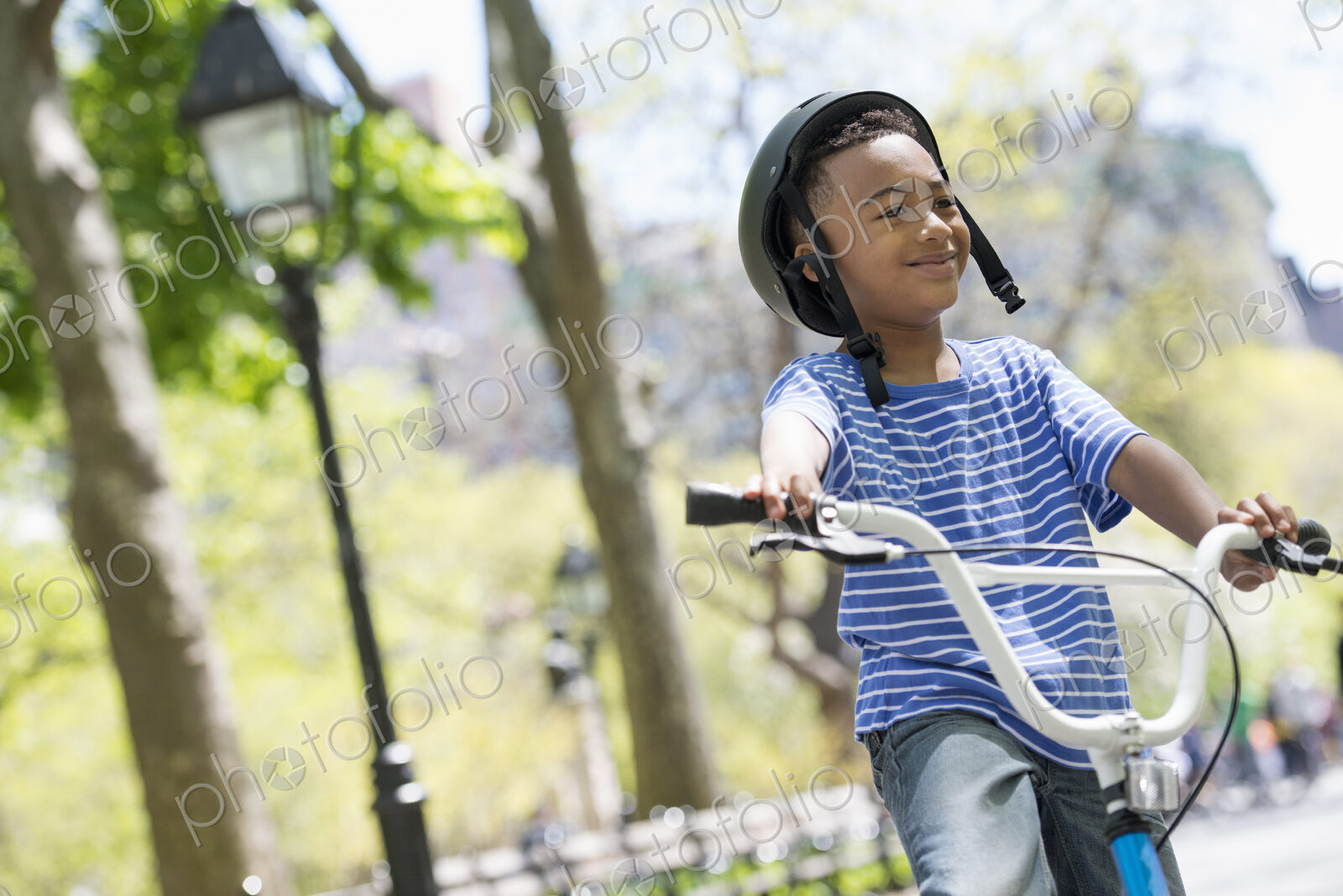 A family in the park on a sunny day. Bicycling and having fun.