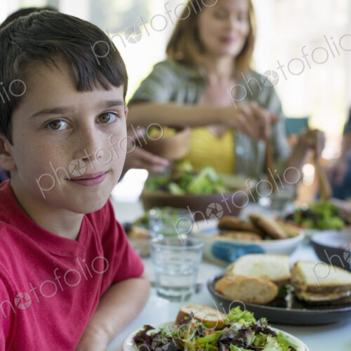A family party around a table in a cafe. Adults and children. A family party around a table in a cafe. Adults and children.
