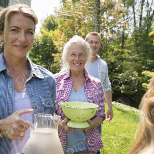 A family summer gathering at a farm. A shared meal, a homecoming. A family summer gathering at a farm. A shared meal, a homecoming.