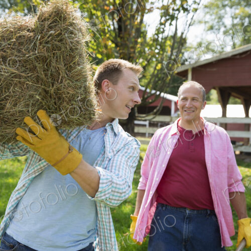 A family summer gathering at a farm. A shared meal, a homecoming. A family summer gathering at a farm. A shared meal, a homecoming.