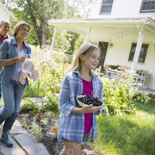 A family summer gathering at a farm. A shared meal, a homecoming. A family summer gathering at a farm. A shared meal, a homecoming.