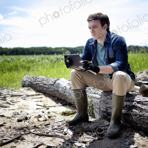 A farmer working in his fields in New York State, USA. A farmer working in his fields in New York State, USA.