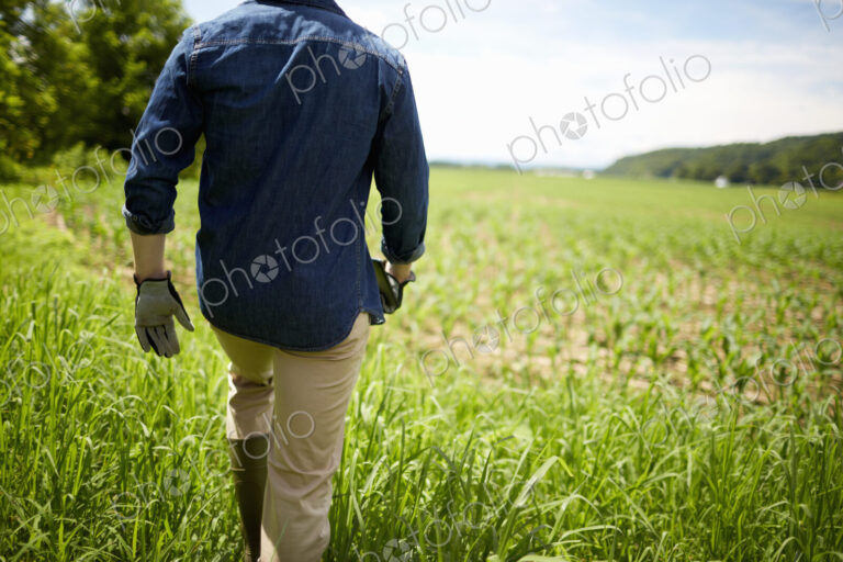 A farmer working in his fields in New York State, USA.