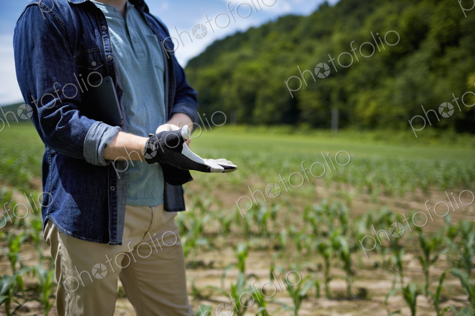 A farmer working in his fields in New York State, USA.
