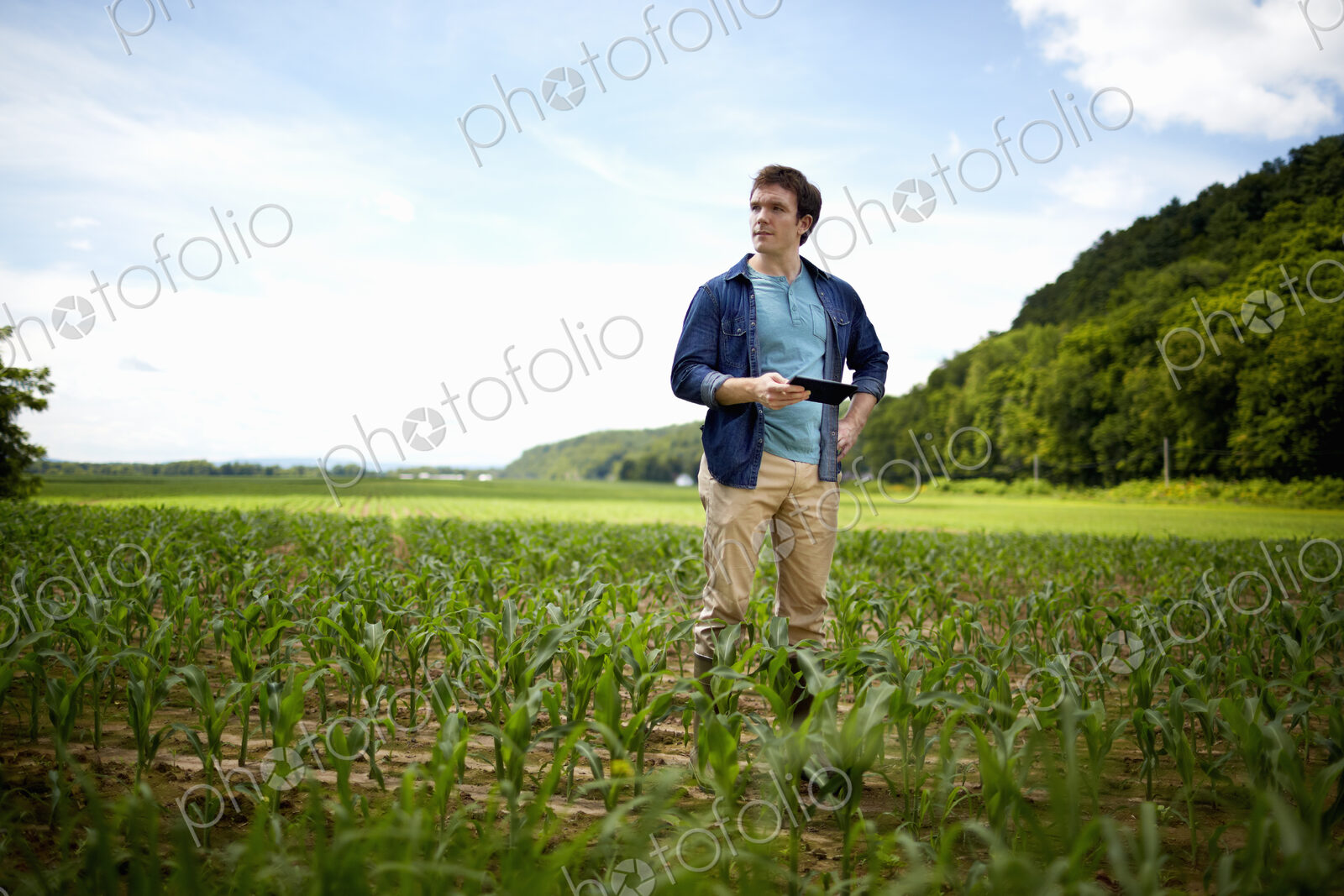 A farmer working in his fields in New York State, USA.