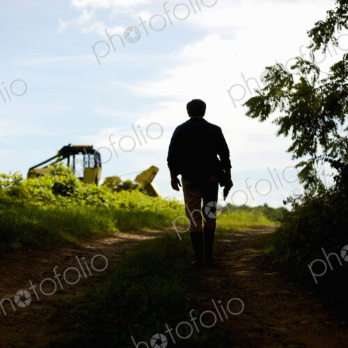 A farmer working in his fields in New York State, USA. A farmer working in his fields in New York State, USA.