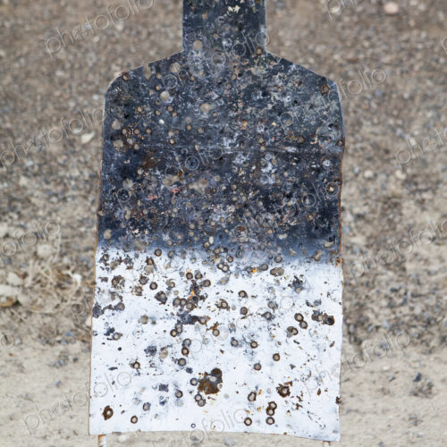 A firing practice target in the shape of a person, on a desert firing range in Nevada. A firing practice target in the shape of a person, on a desert firing range in Nevada.