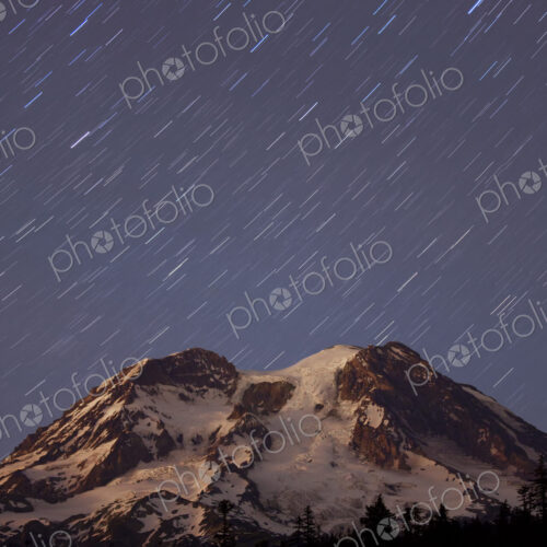 A five minute timed exposure of the night sky and a shower of stars above Mount… A five minute timed exposure of the night sky and a shower of stars above Mount…