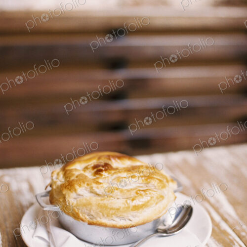 A freshly baked pie with a pastry top on a table A freshly baked pie with a pastry top on a table