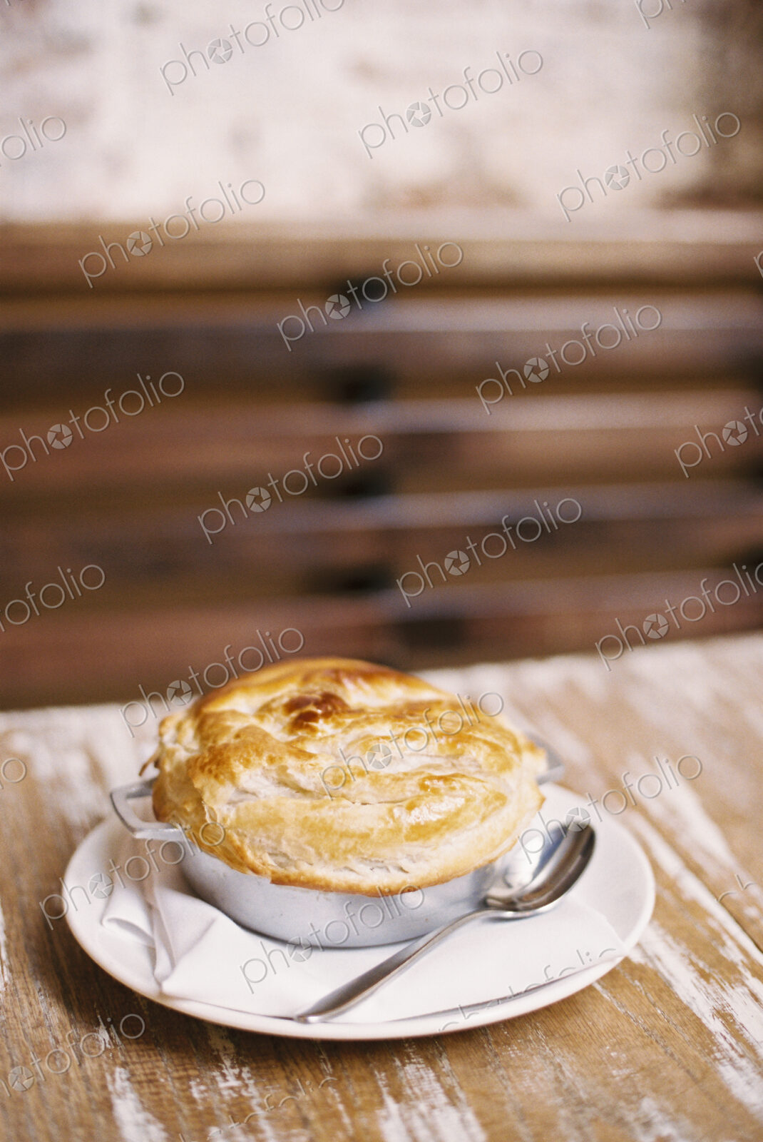A freshly baked pie with a pastry top on a table