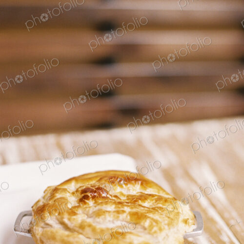 A freshly baked pie with a pastry top on a table A freshly baked pie with a pastry top on a table