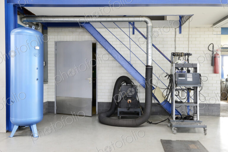 A garage or auto repair shop air pressure valve with compressor machine