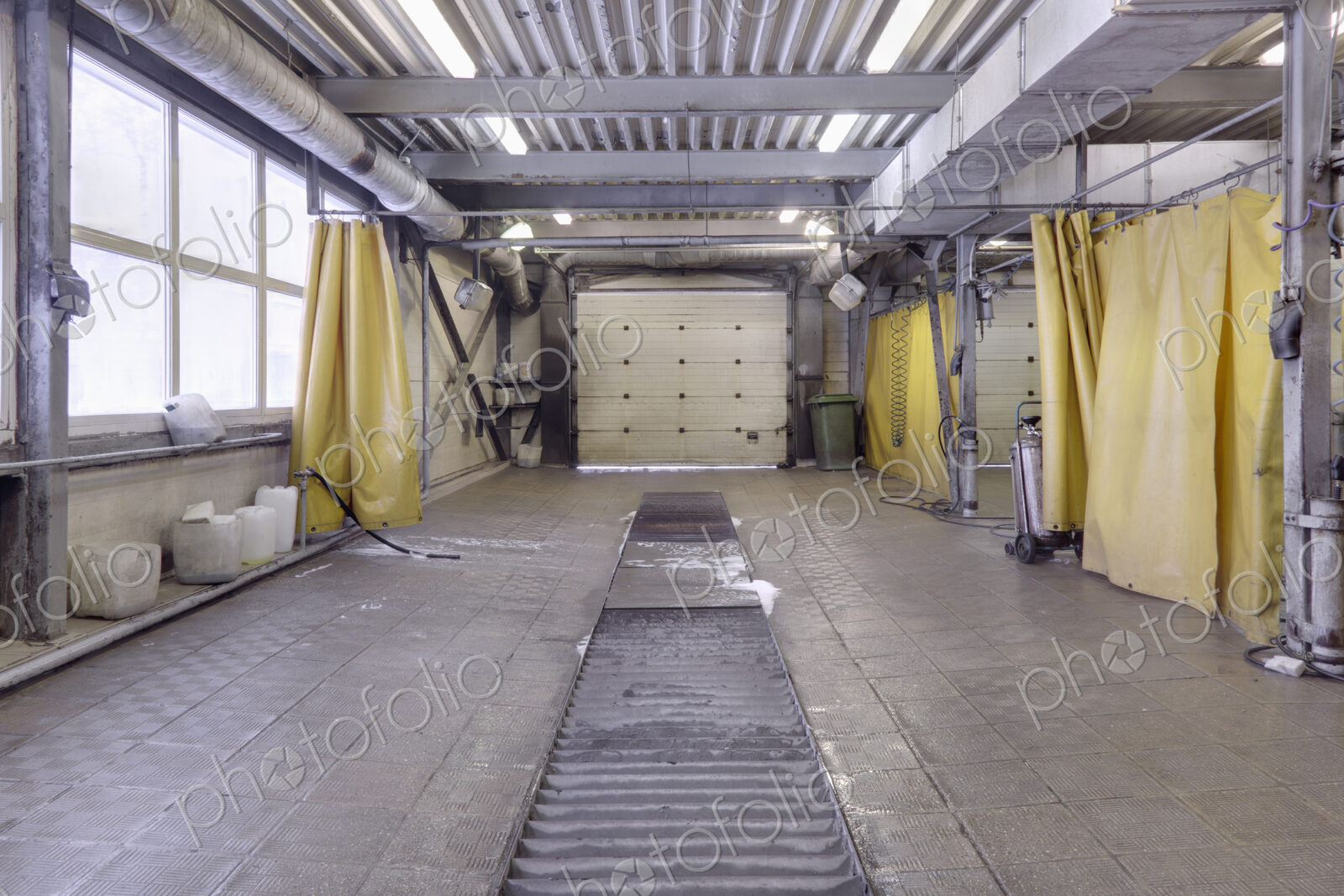 A garage workshop, car washing area.