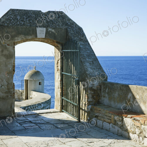 A gate leading to another portion of the old wall surrounding the city of Dubrovnik A gate leading to another portion of the old wall surrounding the city of Dubrovnik