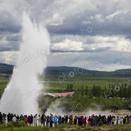 A geysir, a plume of hot steam escaping from the ground at hot springs.