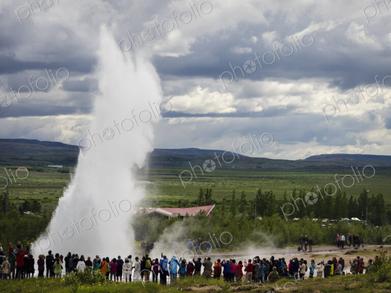 A geysir, a plume of hot steam escaping from the ground at hot springs.