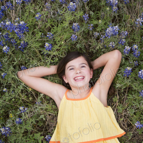 A girl lying on the grass amid wild flowers. A girl lying on the grass amid wild flowers.