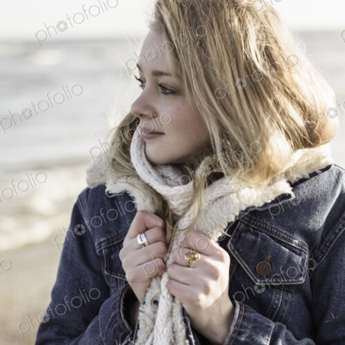 A girl on a beach in winter A girl on a beach in winter