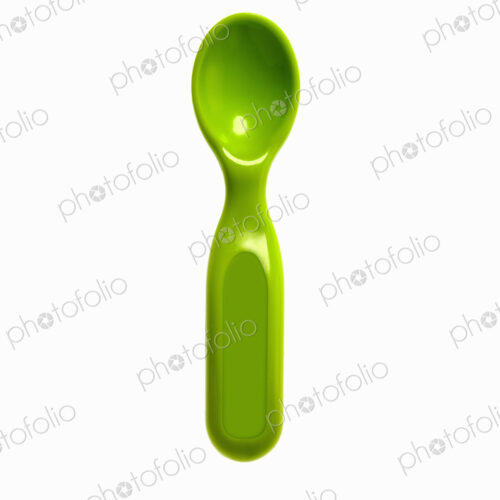 A green plastic baby spoon.