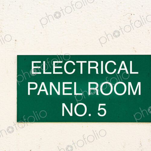 A green sign on a wall, Electrical Panel Room No. 5