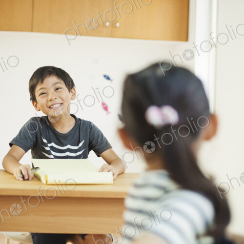 A group of children in a classroom.