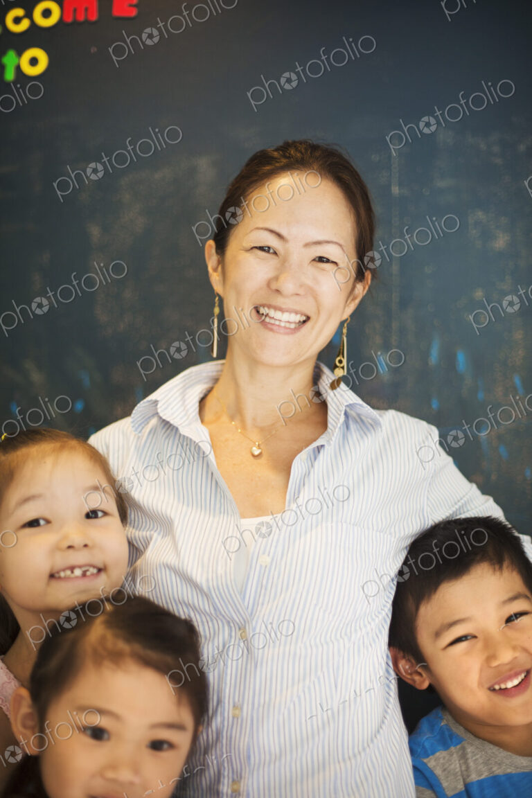 A group of children in school with a teacher.