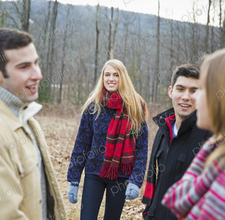 A group of four people outdoors on a winter day.