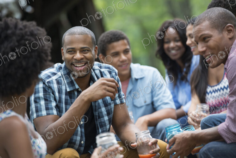 A group of men and women outdoors enjoying themselves.