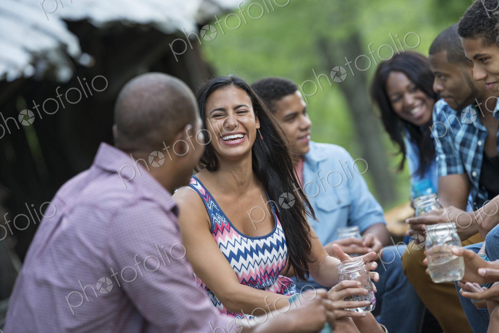A group of men and women outdoors enjoying themselves.