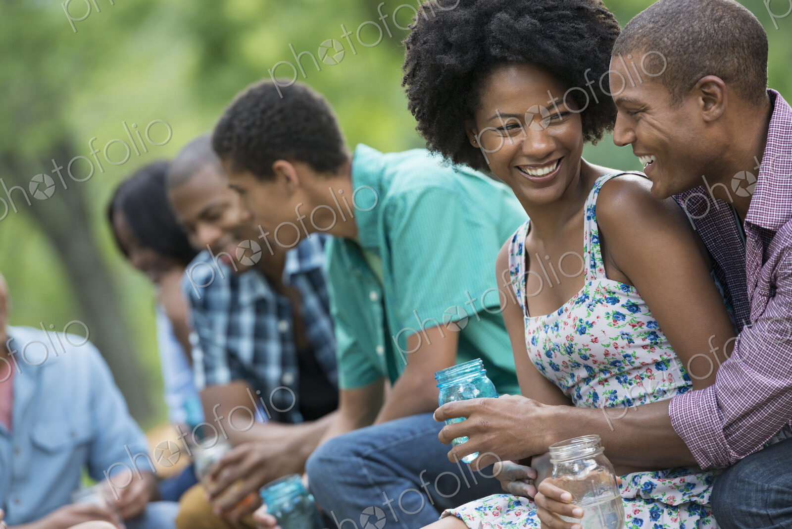 A group of men and women outdoors enjoying themselves.