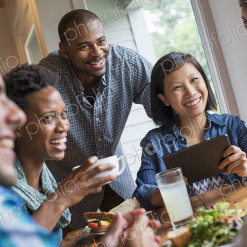 A group of people meeting in a cafe. Using digital tablets and smart phones. A group of people meeting in a cafe. Using digital tablets and smart phones.