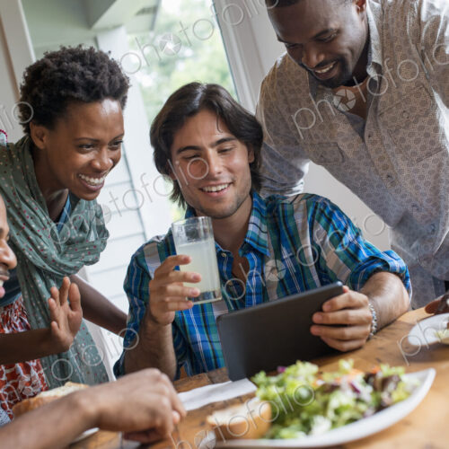 A group of people meeting in a cafe. Using digital tablets and smart phones. A group of people meeting in a cafe. Using digital tablets and smart phones.