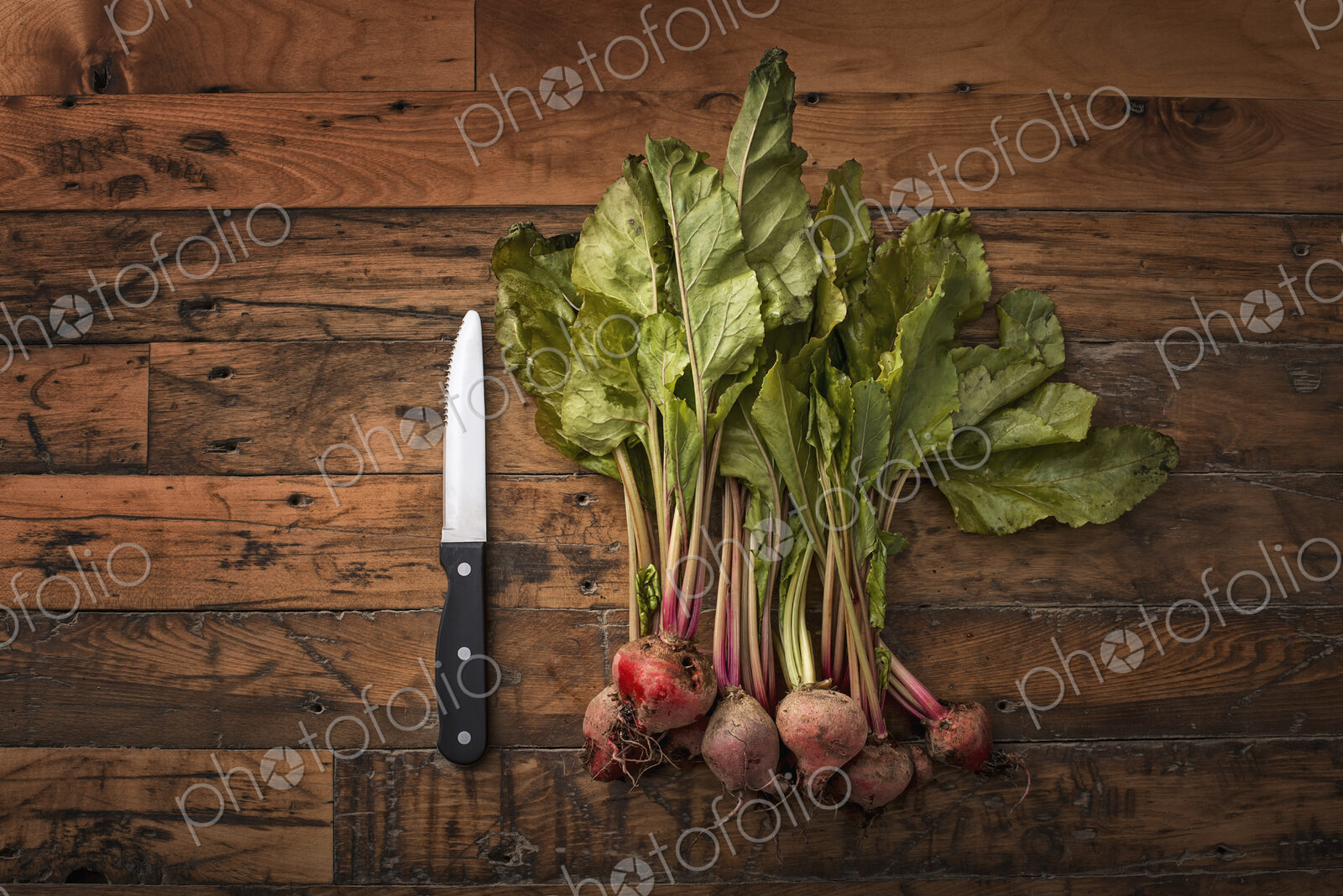 A handful of small beets, fresh organic vegetables harvested for the table. A…