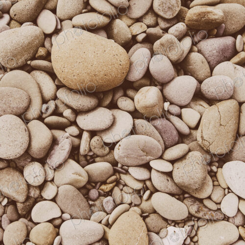 A heap of polished pebbles and small flat stones in Olympic national park. A heap of polished pebbles and small flat stones in Olympic national park.