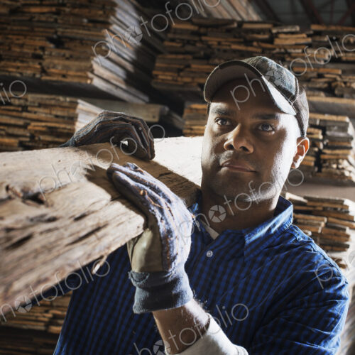 A heap of recycled reclaimed timber planks of wood. Environmentally responsible… A heap of recycled reclaimed timber planks of wood. Environmentally responsible…