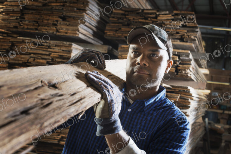 A heap of recycled reclaimed timber planks of wood. Environmentally responsible…