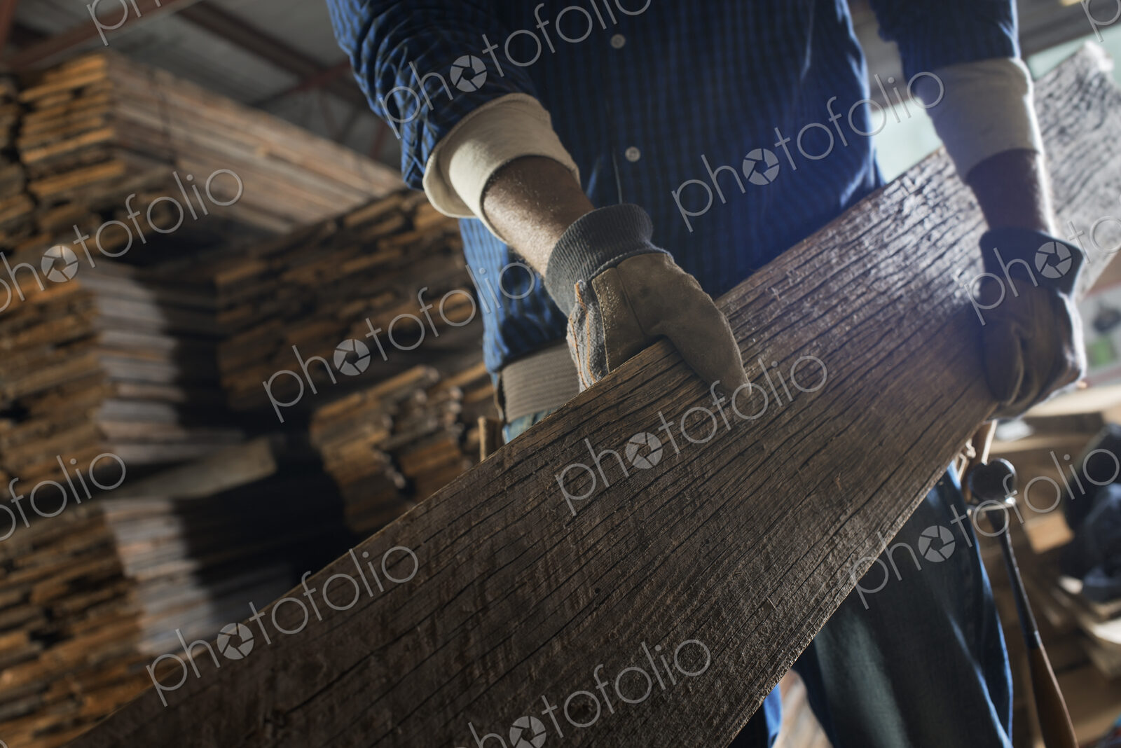 A heap of recycled reclaimed timber planks of wood. Environmentally responsible…