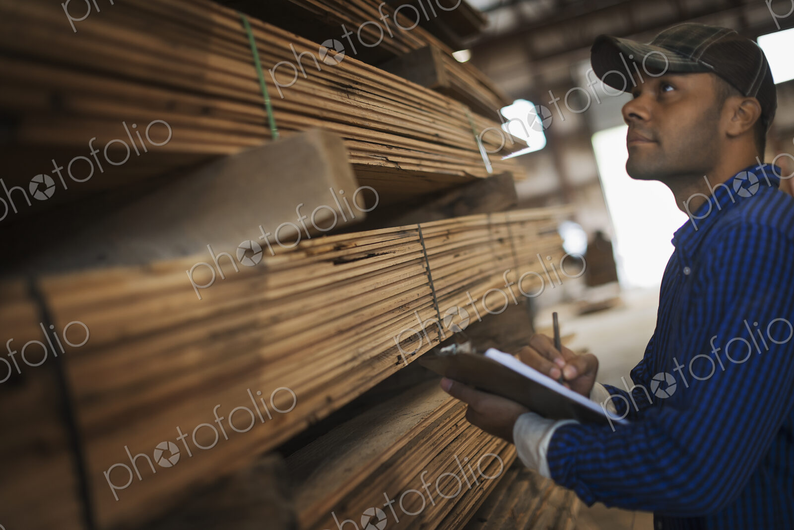 A heap of recycled reclaimed timber planks of wood. Environmentally responsible…