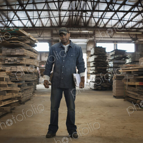 A heap of recycled reclaimed timber planks of wood. Environmentally responsible…