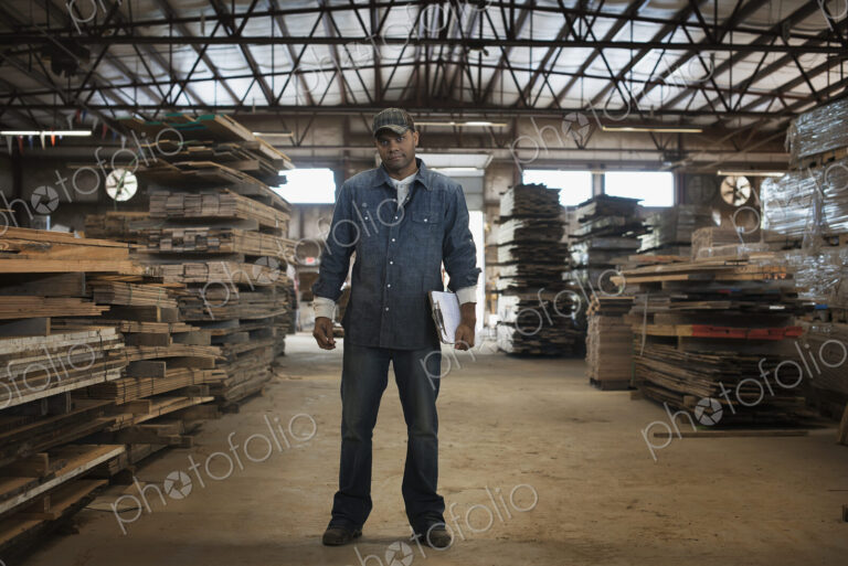 A heap of recycled reclaimed timber planks of wood. Environmentally responsible…