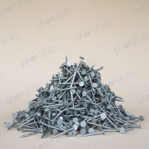 A heaped pile of galbanised nails.