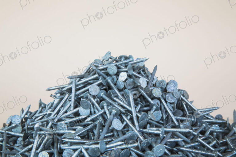 A heaped pile of galbanised nails.