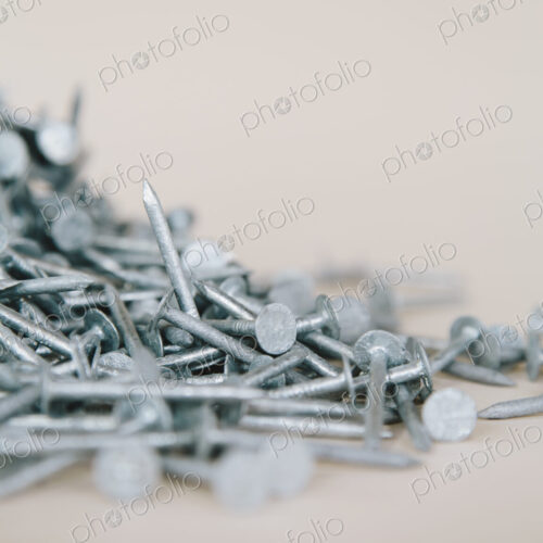 A heaped pile of galbanised nails.