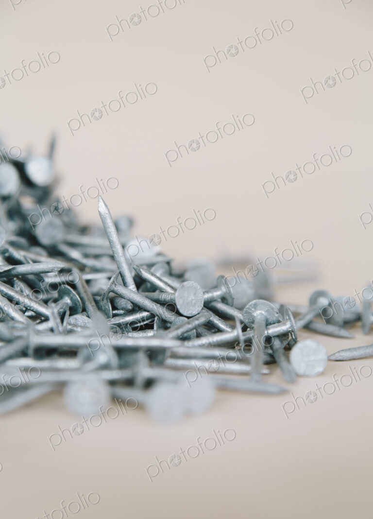 A heaped pile of galbanised nails.