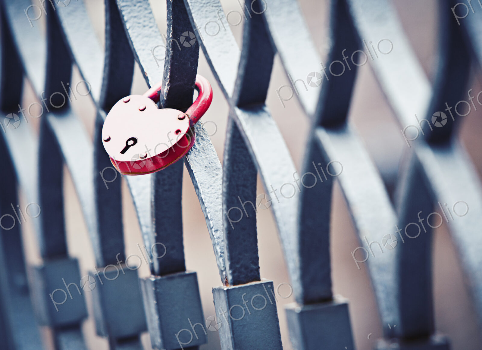 A heart shaped lock left by two lovers on a bridge railing in the city of love, Venice