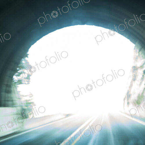 A highway tunnel entry into bright light, Washington