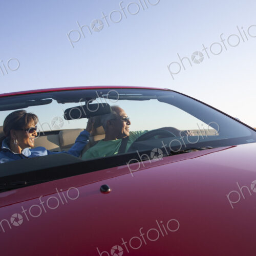 A hip senior Hispanic couple on a road trip in eastern Washington State, USA.