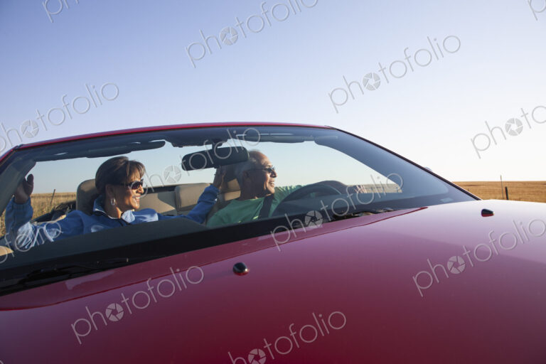 A hip senior Hispanic couple on a road trip in eastern Washington State, USA.