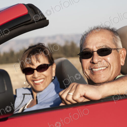A hip senior Hispanic couple on a road trip in eastern Washington State, USA.