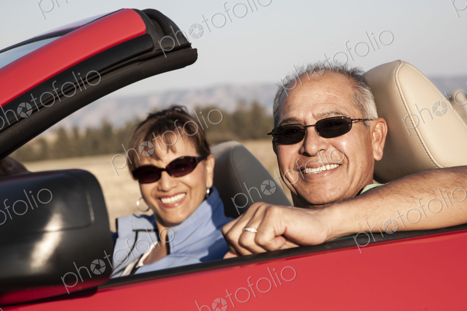 A hip senior Hispanic couple on a road trip in eastern Washington State, USA.